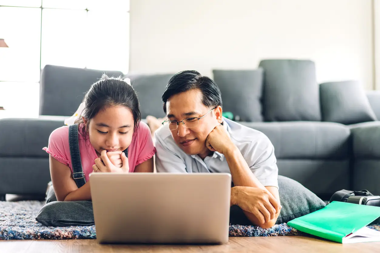 Father and daughter talk about finances and saving for college